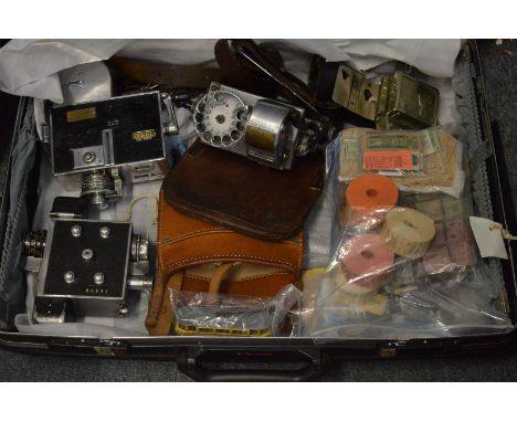 A collection of train or bus ticket machines with numerous rolls of tickets, pre-stamped tickets and other items to include l