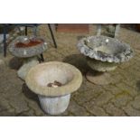 Two reconstituted stone planters and a bird bath.