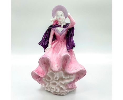 Hand painted bone china figure depicting lady in a beautiful blush pink gown with lavender touches and matching hat with viol
