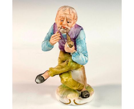 Hand-painted porcelain figurine modeled as an old man seated on a stump with a thoughtful expression while smoking a pipe. 15