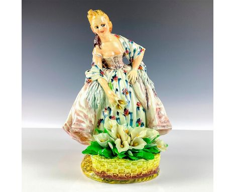 Glossy finish porcelain figure of a lady in a colorful dress holding flowers with basket. C. Mollica signed and Made in Italy