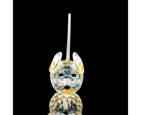 This retired Swarovski crystal mini mouse was designed by Max Schreck. Made from clear crystal, with black eyes and nose, the