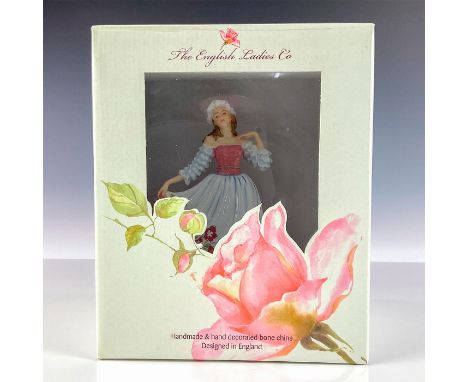 Factory sealed hand made and hand decorated bone china depicting a woman in a colorful gown with floral pattern.The English L