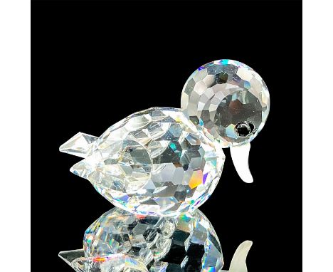 This retired Swarovski crystal mini swimming duck was part of the Beauties of the Lake theme group. The duck has a clear crys