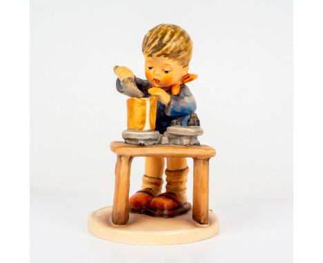 Porcelain hand painted in matte finish. Goebel backstamp. Impressed M. I. Hummel to round base. Dimensions: 2.75"L x 3.75"W x