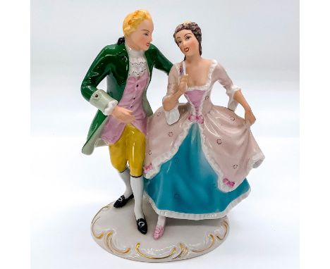 Depicting elegantly dressed couple engaged in conversation, with gold accents to base. Royal Dux Bohemia backstamp.This item 