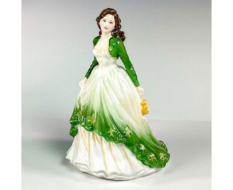 Glossy finish bone china depicting a lady in a beautiful green and white victorian dress, holding a yellow hand purse.Royal D