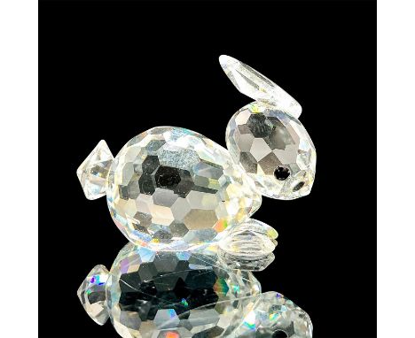 This retired Swarovski crystal mini resting rabbit was a member of the In a Summer Meadow theme and is made from clear crysta