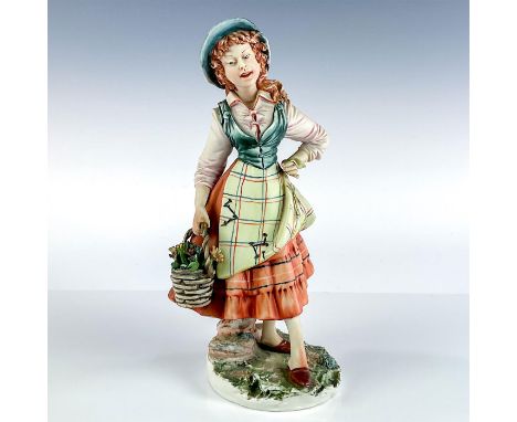 Stunning Italian figure of woman with flower basket. Orange, green, and brown coloration.Meneghetti signed to base. Capodimon
