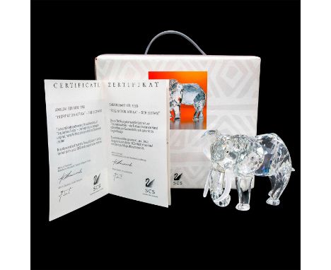 Depicts a clear crystal elephant with fogged crystal tusks. This item has its original box. Dimensions of the original box: 7