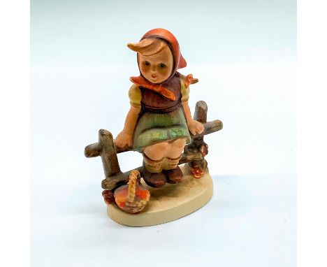 Matte porcelain, hand painted. Young girl resting on a wooden fence with a basket by her side. 'M. I. Hummel' inscribed on ba