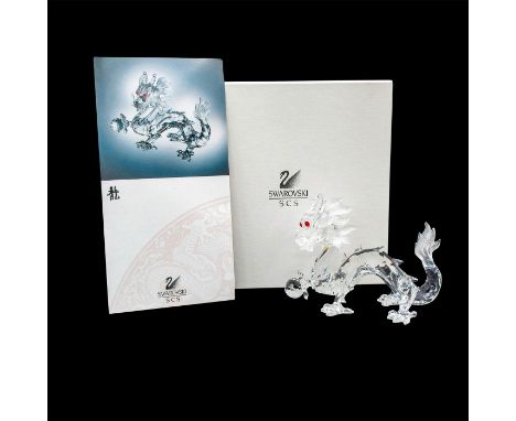 Brilliant clear crystal Annual Edition from the Fabulous Creatures series, The Dragon with red eyes and ball. This item has i