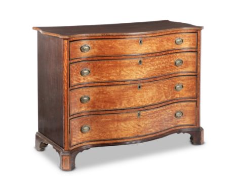 A George III satinwood, mahogany, tulipwood crossbanded and chequer inlaid featherbanded serpentine commode1780-1800, probabl