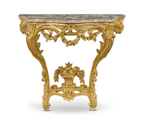 A Louis XV giltwood console table1750-1760, the marble top of a later dateOf shaped outline with projecting eared front angle