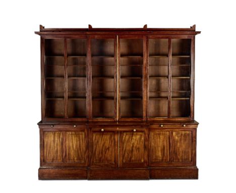 A Regency mahogany and ebonised line-inlaid breakfront bookcase with the innovative feature of sliding doorsCirca 1810The ovo
