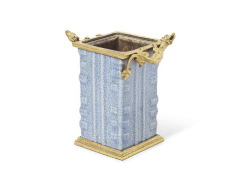 A French gilt bronze mounted Chinese pale celadon blue crackle crazed porcelain vase or cache potThe mounts in the Regence ta