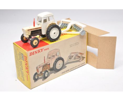 Dinky No. 325 David Brown Tractor with Disc Harrow.  Displays generally very good. The odd minor sign of wear. In very good t