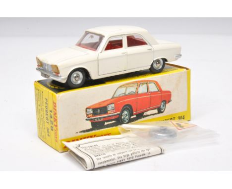 French Dinky no. 1428 Peugeot 304. Off-white with red interior. Displays generally excellent. Little sign of wear. In excelle