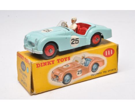 Dinky no. 111 Triumph TR2 Sports. Blue with red interior and hubs. Displays generally fair due to windscreen with paint very 
