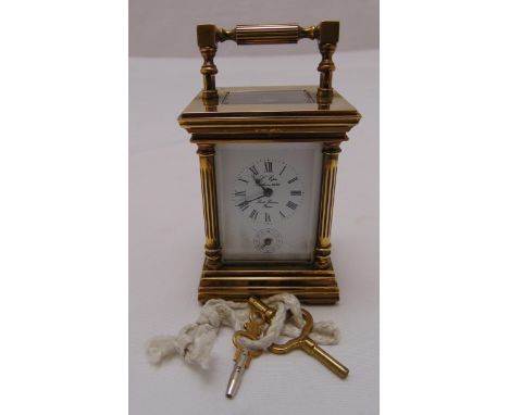 A L'pee France miniature brass carriage clock of customary form with white enamel dial, Roman numerals and a subsidiary secon