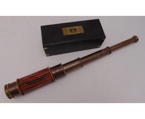 An early 20th century three draw hexagonal brass telescope in wooden fitted case