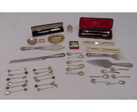 A quantity of hallmarked silver and white metal to include flatware, condiments and a Mappin and Webb cased pair of pickle fo