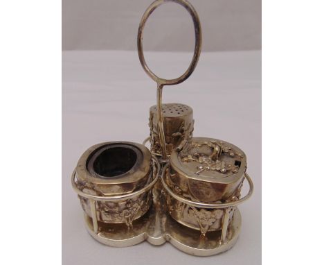 A Chinese white metal three piece condiment set comprising a mustard pot, a pepperrete and a salt with detachable liner all w