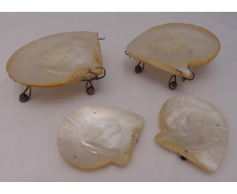 A pair Victorian mother of pearl dishes on stands and another pair on three ball feet