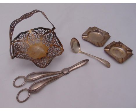 A quantity of hallmarked silver to include a bonbon dish, grape scissors, two ashtrays and a cream ladle, approx total weight