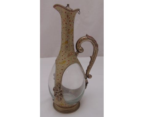 A continental pewter and enamel claret jug with scroll handle, pull off cover on circular spreading base, 29.5cm (h)