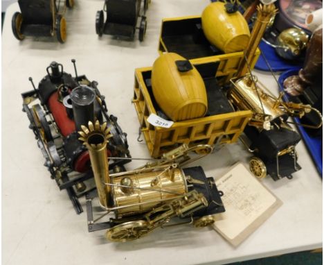 A modern metal model of Stephenson's Rocket, another similar, and a further train. (3) 