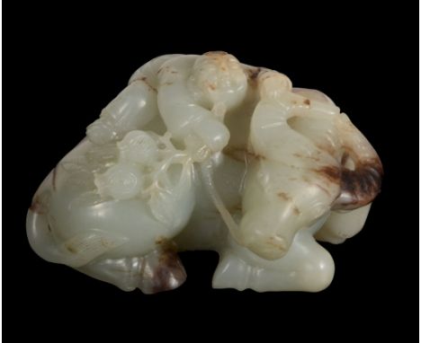 A Chinese celadon and brown jade buffulo and rider , 20th century, 9cm diam; 5 A Chinese celadon and brown jade buffulo and r