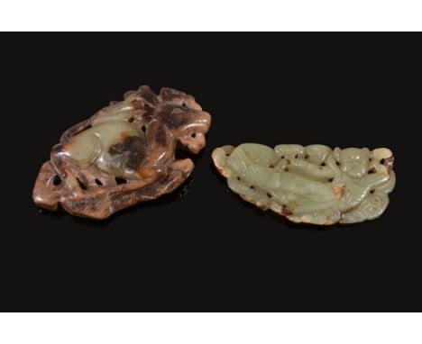 A Chinese celadon and tan jade carving of a deer, with incised details, 7 A Chinese celadon and tan jade carving of a deer, w