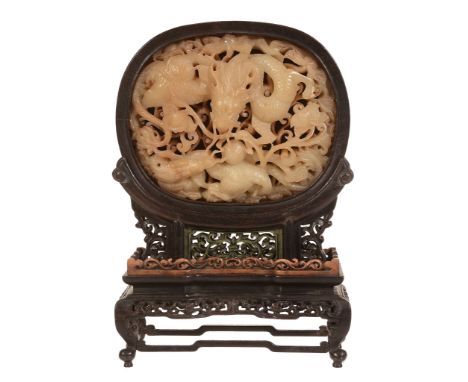 A Chinese jade oval Ming-style confronting dragon table screen, Qing Dynasty A Chinese jade oval Ming-style confronting drago