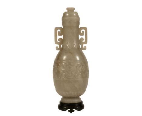 An attractive Chinese celadon jade vase and cover, probably Qing Dynasty An attractive Chinese celadon jade vase and cover, p