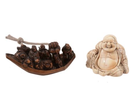 An Ivory Netsuke of Hotei , the portly figure sits reclining against one arm An Ivory Netsuke of Hotei , the portly figure si