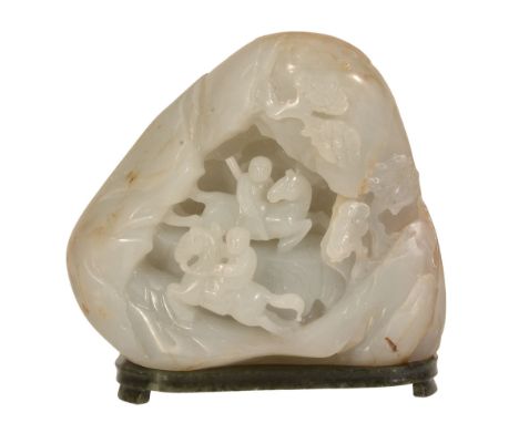 -1 A Chinese celadon and russet jade bolder carving, probably Qing Dynasty -1 A Chinese celadon and russet jade bolder carvin