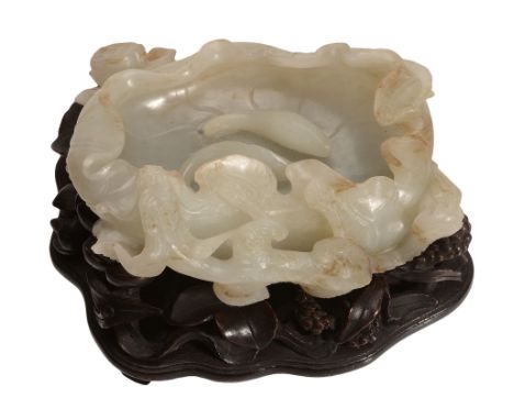A Chinese celadon and russet jade 'Lotus' brush washer A Chinese celadon and russet jade 'Lotus' brush washer, probably late 