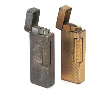 Dunhill Lighters, gold plated and silver plated both engine turned (2).