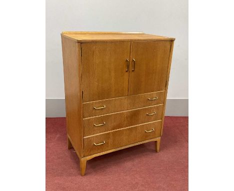 Lebus Oak Tall Boy, with low back, gilt metal handles to cupboard doors, over three drawers, on splayed legs, 77.5cm wide.105