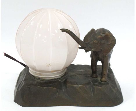 Bronzed Spelter Table Lamp with pink glass shade and elephant surmounted on naturalistic base, 21cm wide.