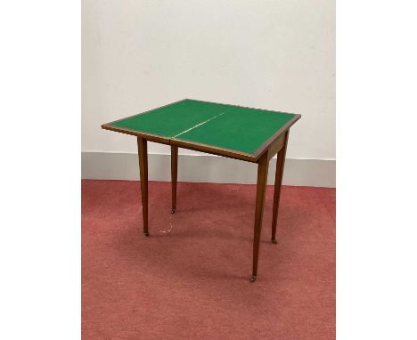 XIX Century Mahogany Fold Over Card Table, on tapering legs and porcelain castors (faults), 76cm wide.