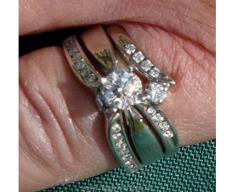 An Exquisite Canadian Diamond Bridal Set of Three Interlocking Rings (Size M) Comprising: A Solitaire Promise Ring with Four 