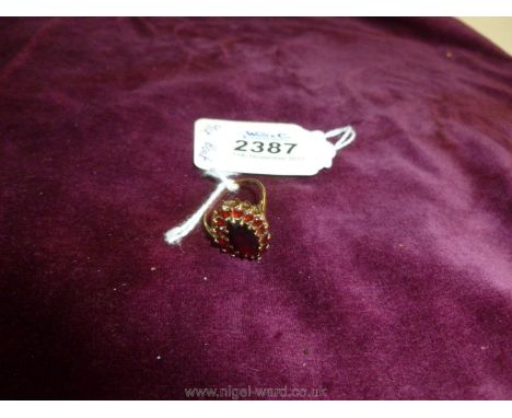 A 9ct Gold garnet boat shaped Ring