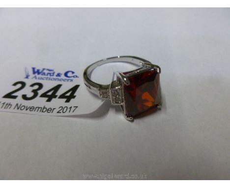 A .925 Silver Emerald cut red Topaz Ring, size P