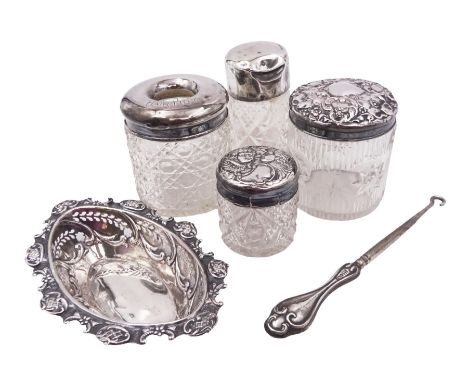 Group of silver, comprising bon bon dish, with pierced sides, four cut glass jars, each with silver covers and a silver handl