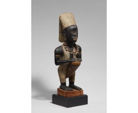 KONGO FIGUREThis fine figure of a drummer would have been placed on an ancestral shrine, "nzo a bakulu". As early as 1686 Olf