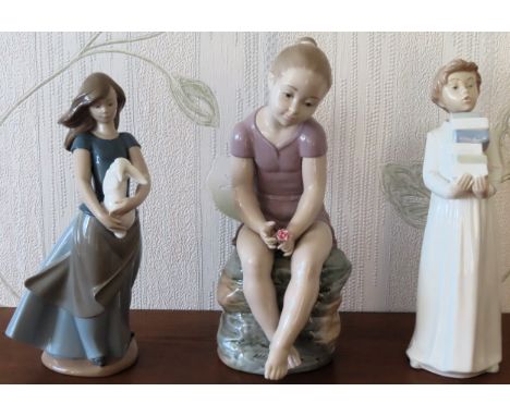 Three various Nao glazed ceramic figures. Largest Approx. 30cms

reasonable used condition 