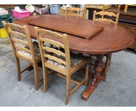 20th century oak extending dining table, with one leaf, also four non matching ladder back chairs

Used condition, surface sc
