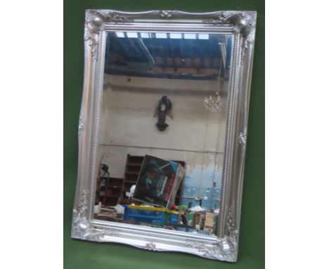 20th century silver coloured framed bevelled wall mirror. Approx. 65 x 91cms

reasonable used with minor scuffs, scratches et